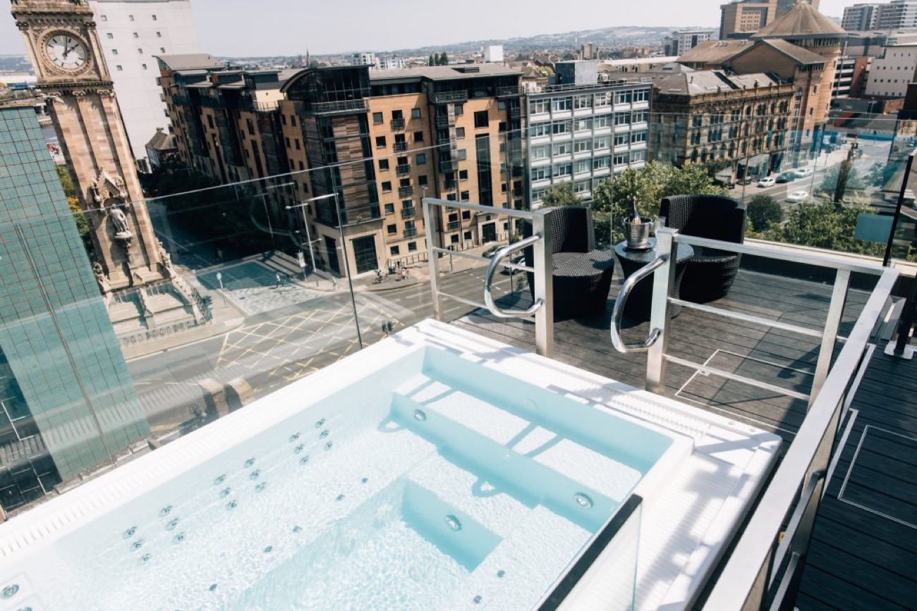 The rooftop hot tub, looking out over the rooftops of Belfast and the Albert Clock.