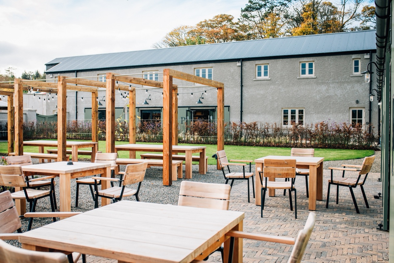 The courtyard café at The Carriage Rooms, with outdoor tables
