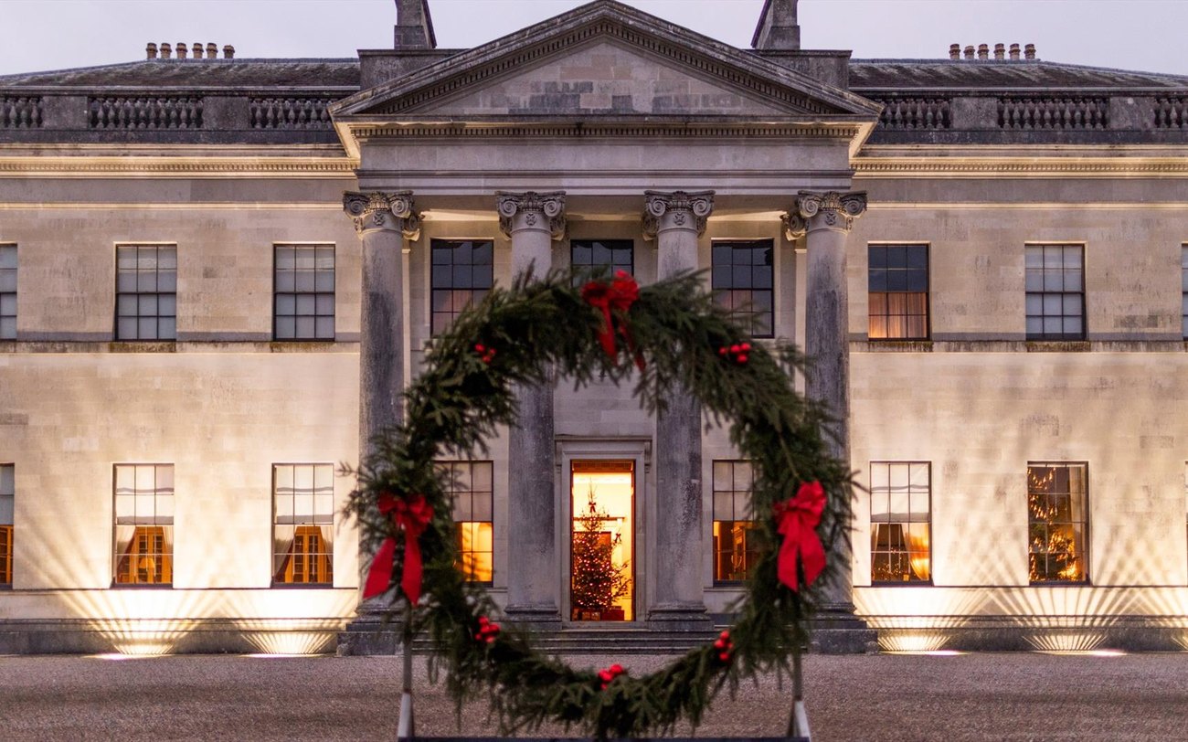 The floodlit Palladian frontage of Castle Coole dressed for Christmas