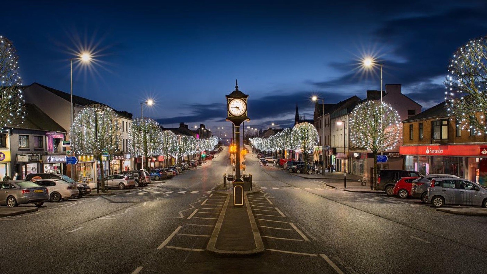 A town centre Christmas tree and lights at the moment of the switch-on