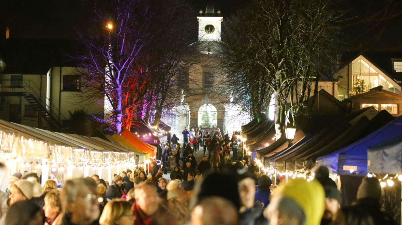 A tree-lined walk lit with festive lights in Royal Hillsborough