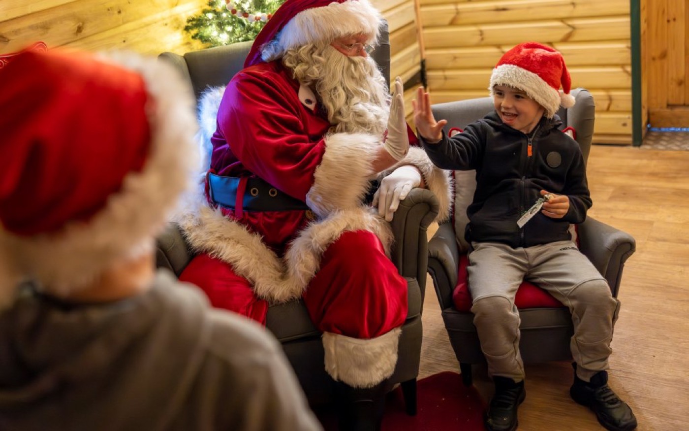 Children meeting Santa in a twinkling workshop at W5 Belfast