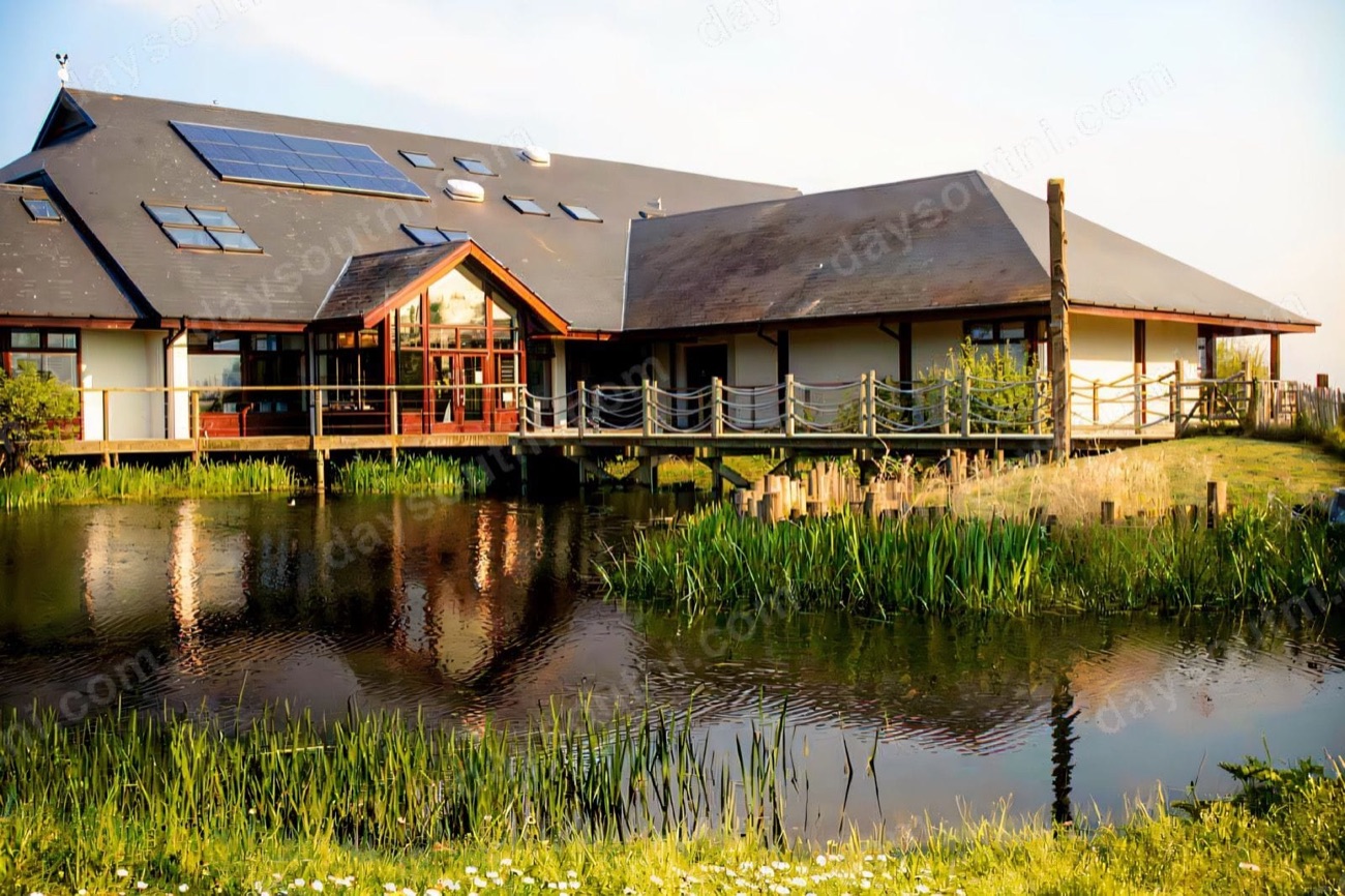 The Lough Neagh Discovery Centre seen across one of the reserve's ponds