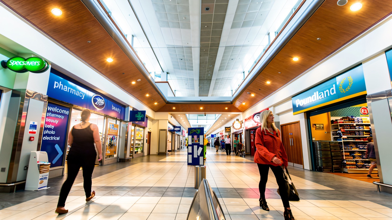 Inside the Park Centre — the wide single-level walkway past Boots, Specsavers and Poundland