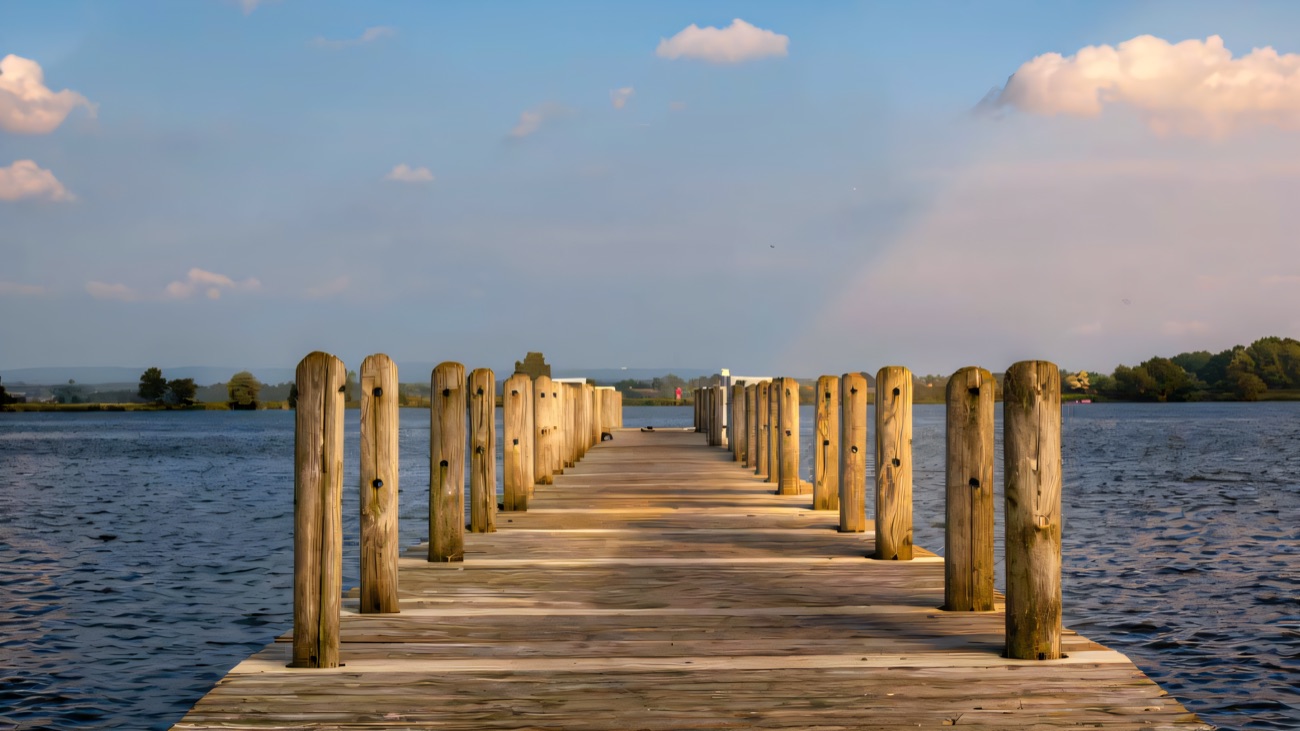 A timber jetty running out into open water