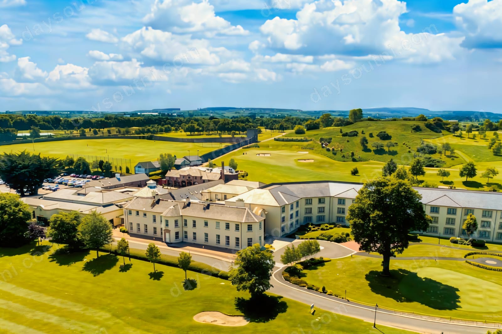 Aerial view of Roe Park Resort hotel set among its golf course and parkland