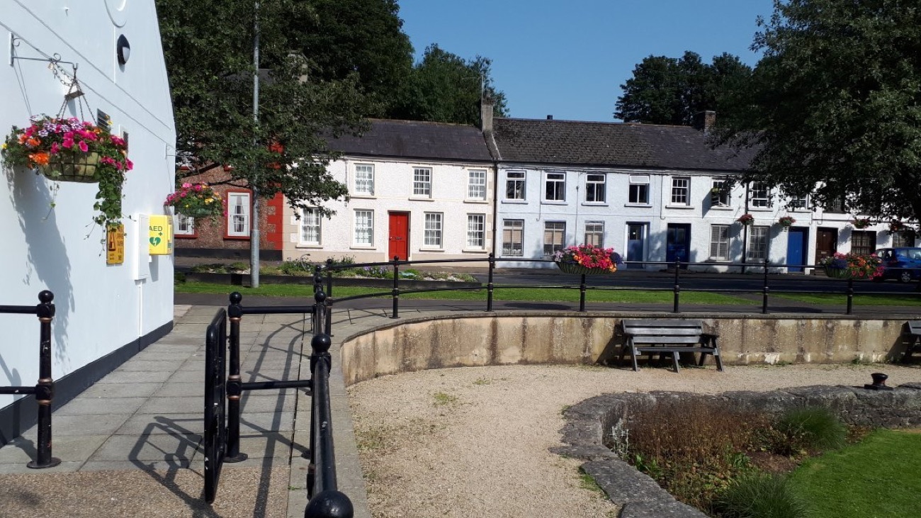 The whitewashed terrace of Scarva village seen across the old canal basin
