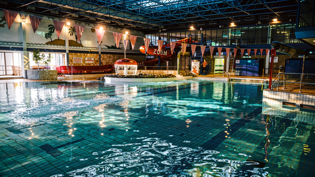 The leisure pool with its mushroom fountain, flume and seaside mural