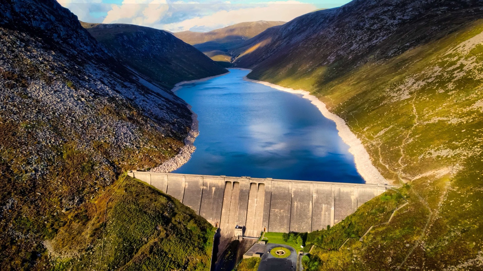 Aerial view of the great dam wall and the reservoir stretching up into the Mourne Mountains