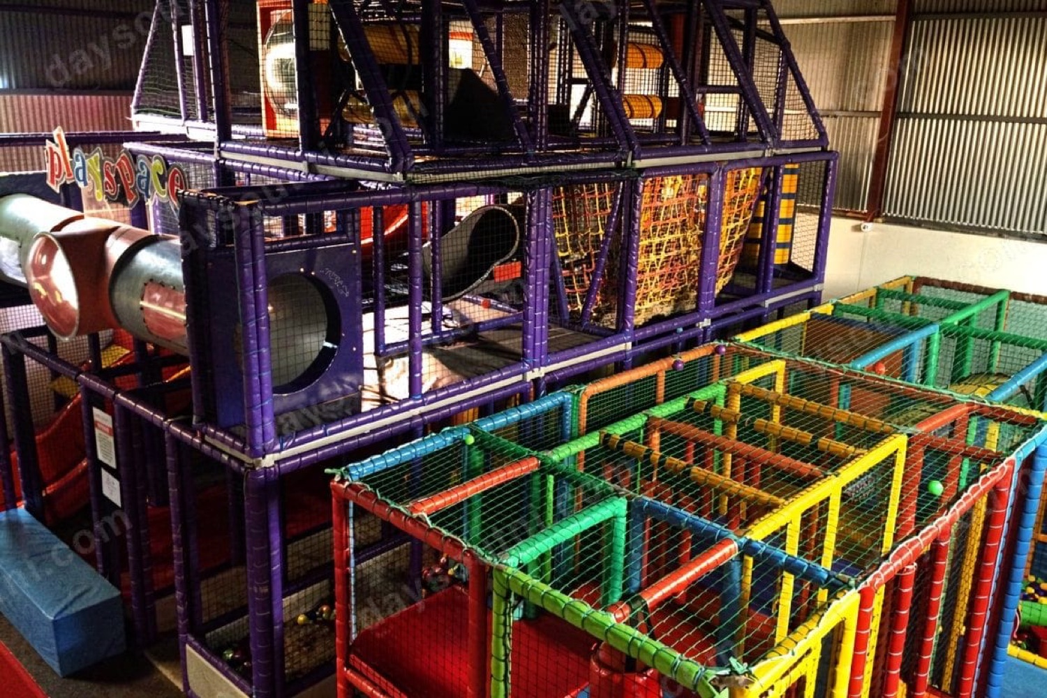 The indoor play frame at Sperrin Fun Farm near Feeny, a colourful multi-level soft-play structure with a maze and slides