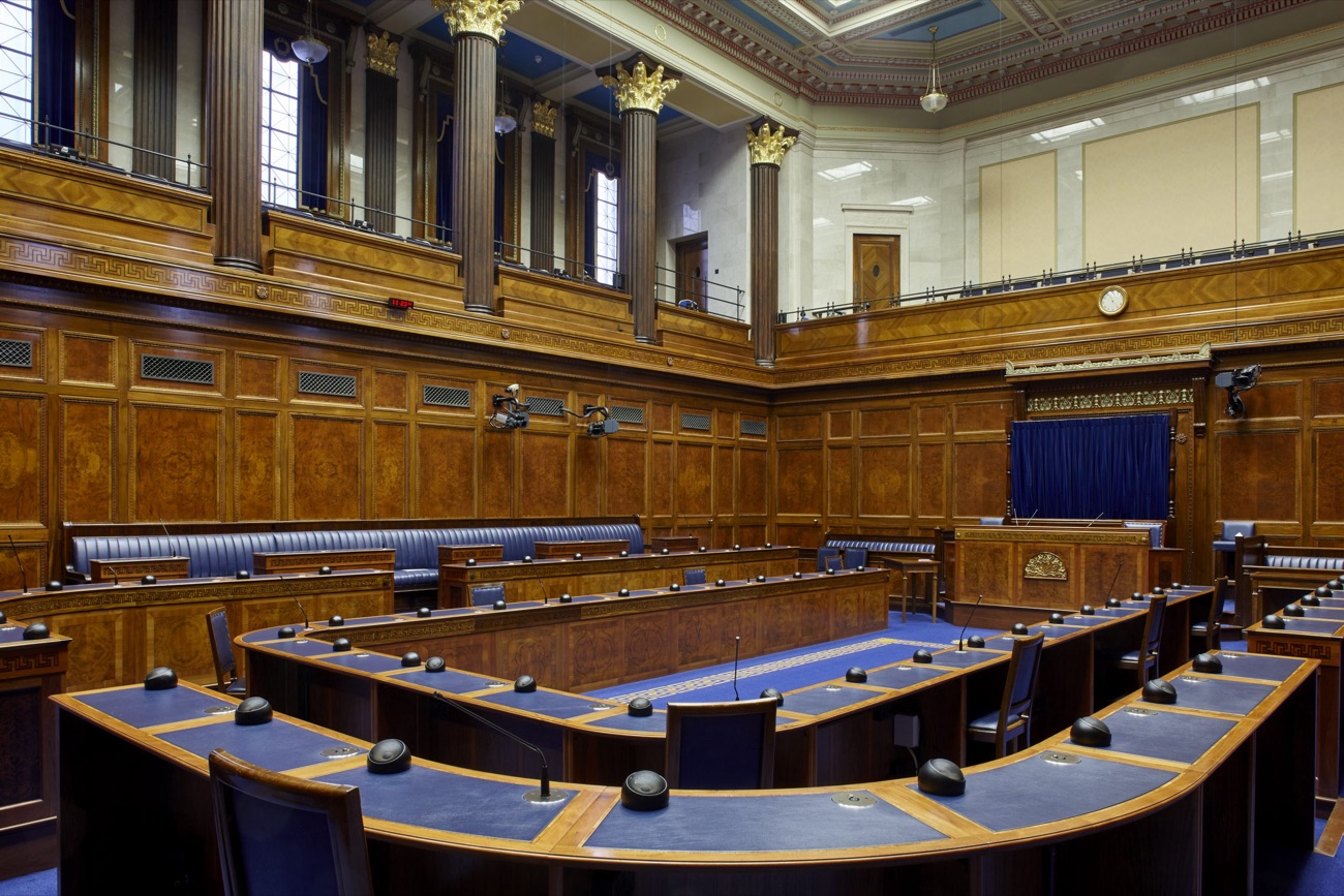 The Northern Ireland Assembly debating chamber, with its blue benches and wood panelling