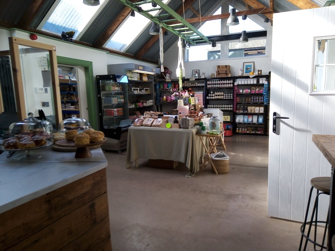 Inside The Croft: timber shelving, cake stands under glass domes and shelves of Irish artisan produce