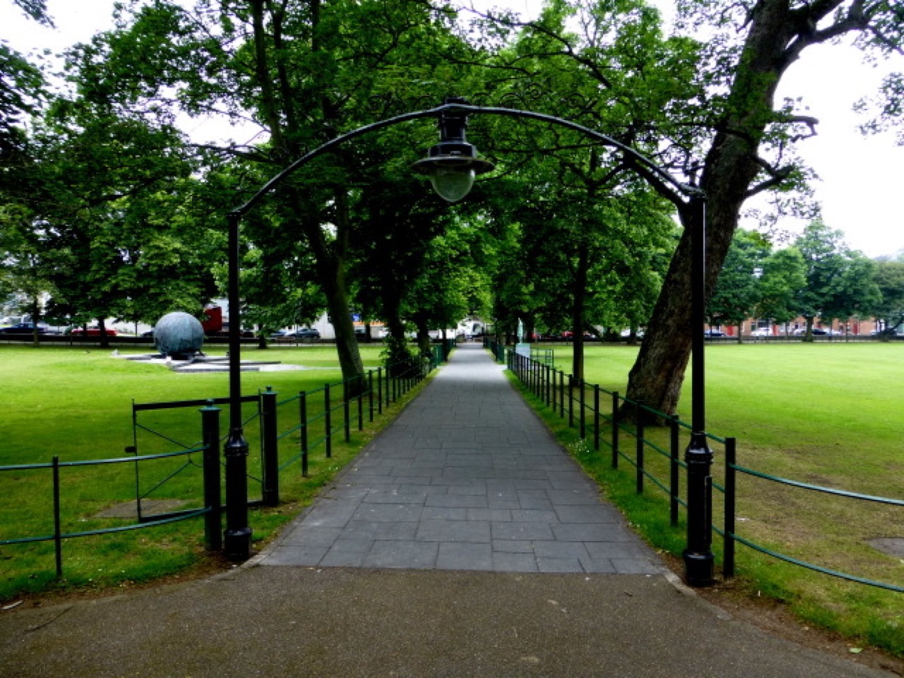 The paved promenade path along The Mall, Armagh, under an avenue of trees