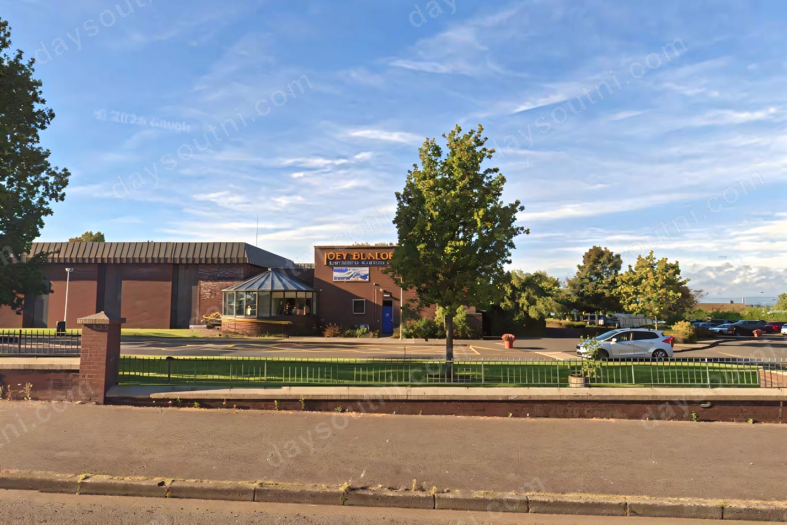The Joey Dunlop Leisure Centre in Ballymoney, home to the Treasure Island soft play, seen from the road with parking in front