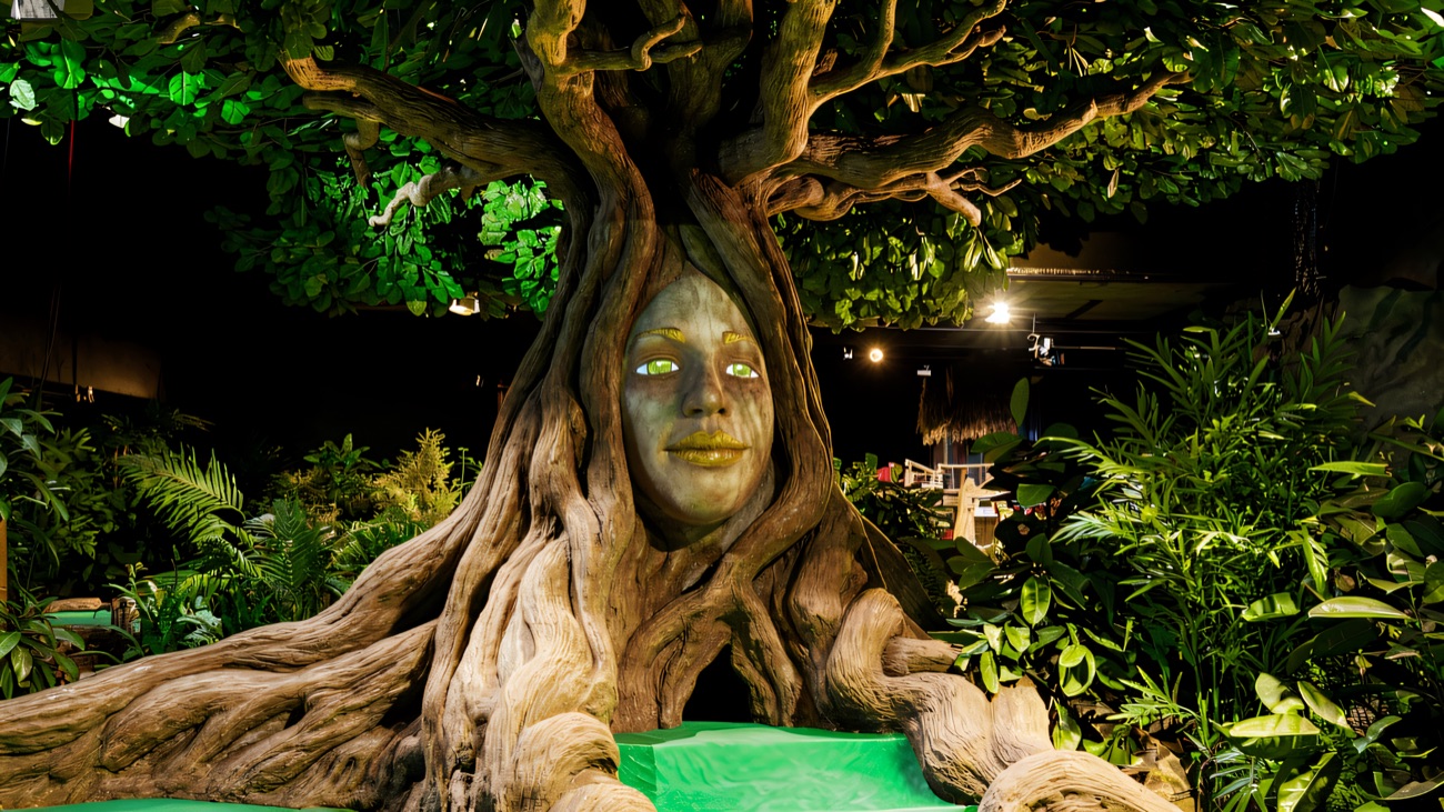 The illuminated spirit tree stands as the course's leafy centrepiece