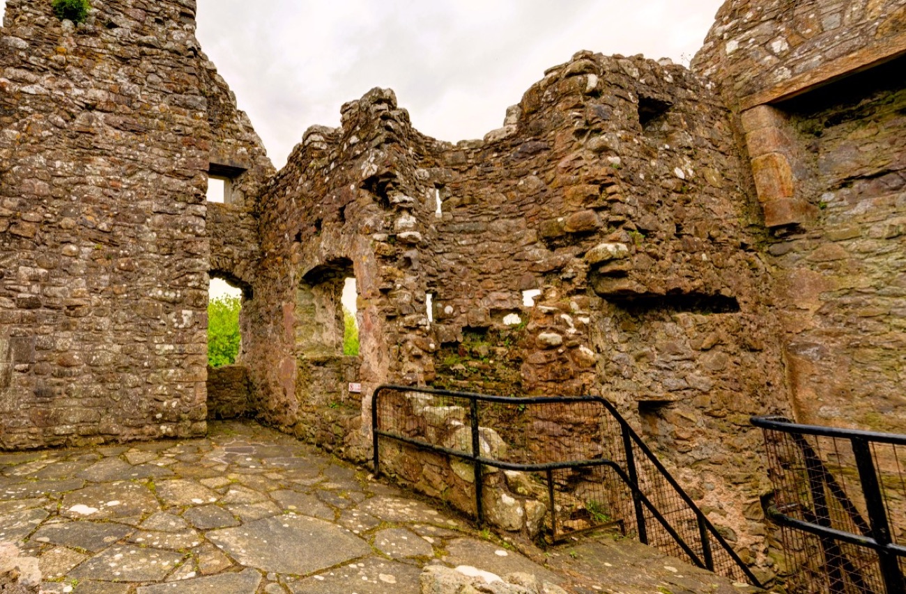 Inside the bawn — the old stone walls and cobbled paths of Tully Castle