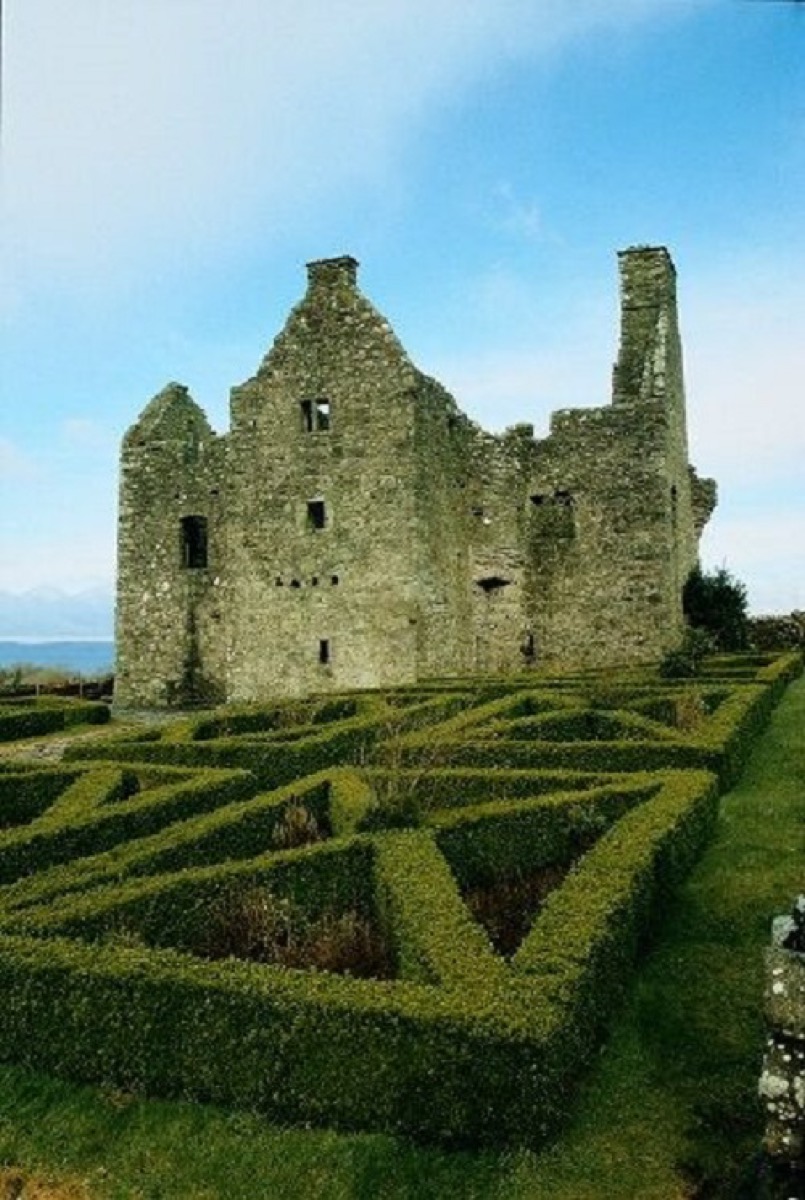 The recreated 17th-century-style box-hedge garden laid out inside the bawn beside the ruin