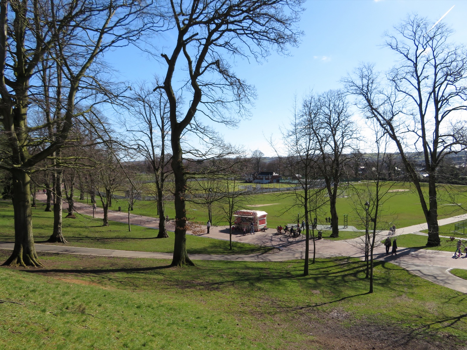 Wallace Park Lisburn — open green with the tree-lined avenue and hills beyond