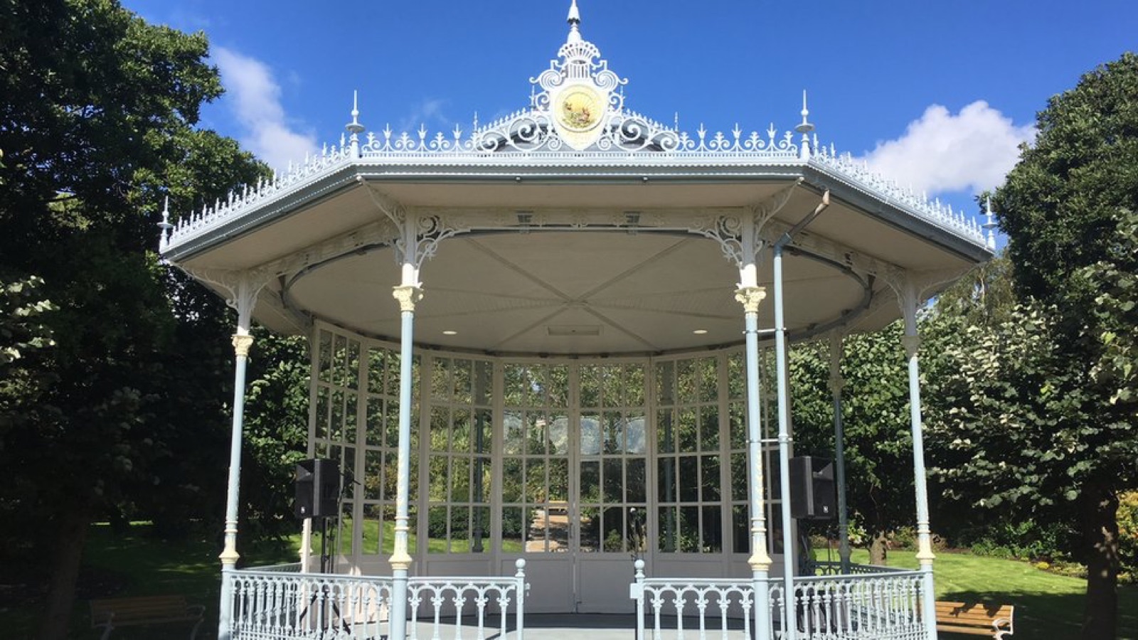 The ornate white Edwardian bandstand at Warrenpoint Municipal Park against a blue sky