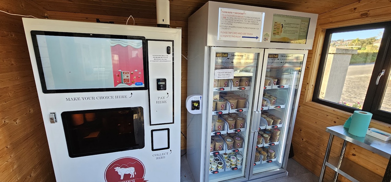 The milkshake machine and stocked fridges along the timber wall of the cabin
